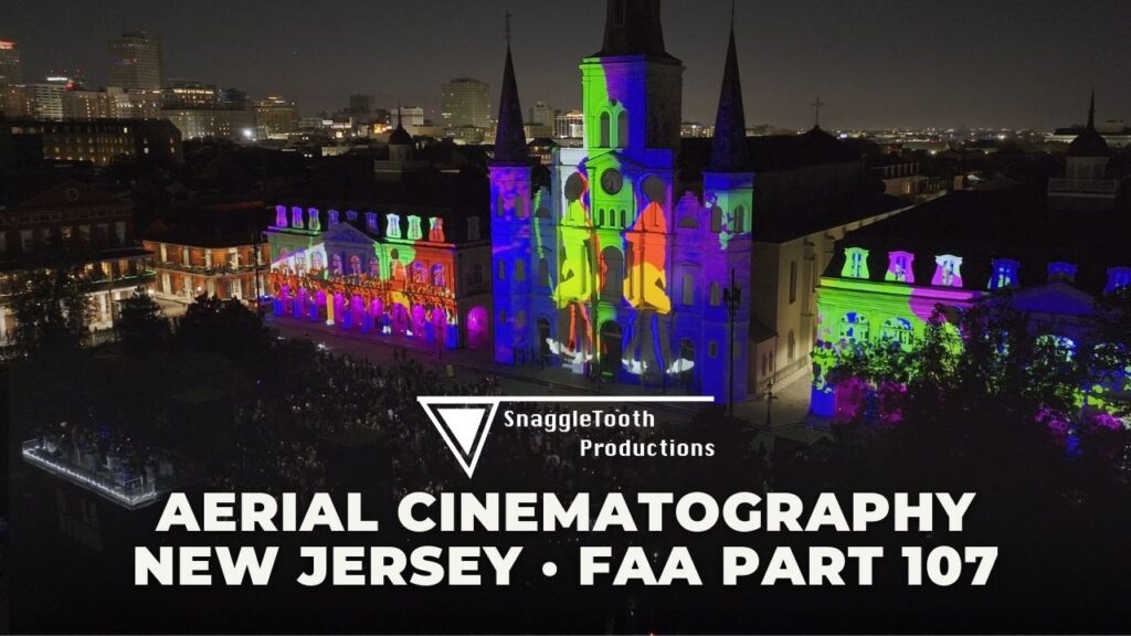 Thumbnail for SnaggleTooth Production aerial demo reel. St. Louis Cathedral lit up by projectors showing silhouettes of people dancing.